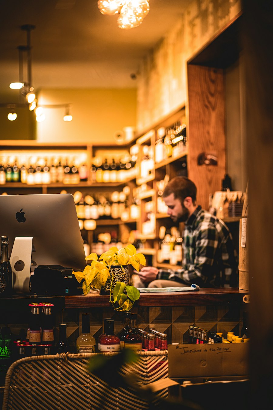 A warmly lit shop interior with shelves of goods